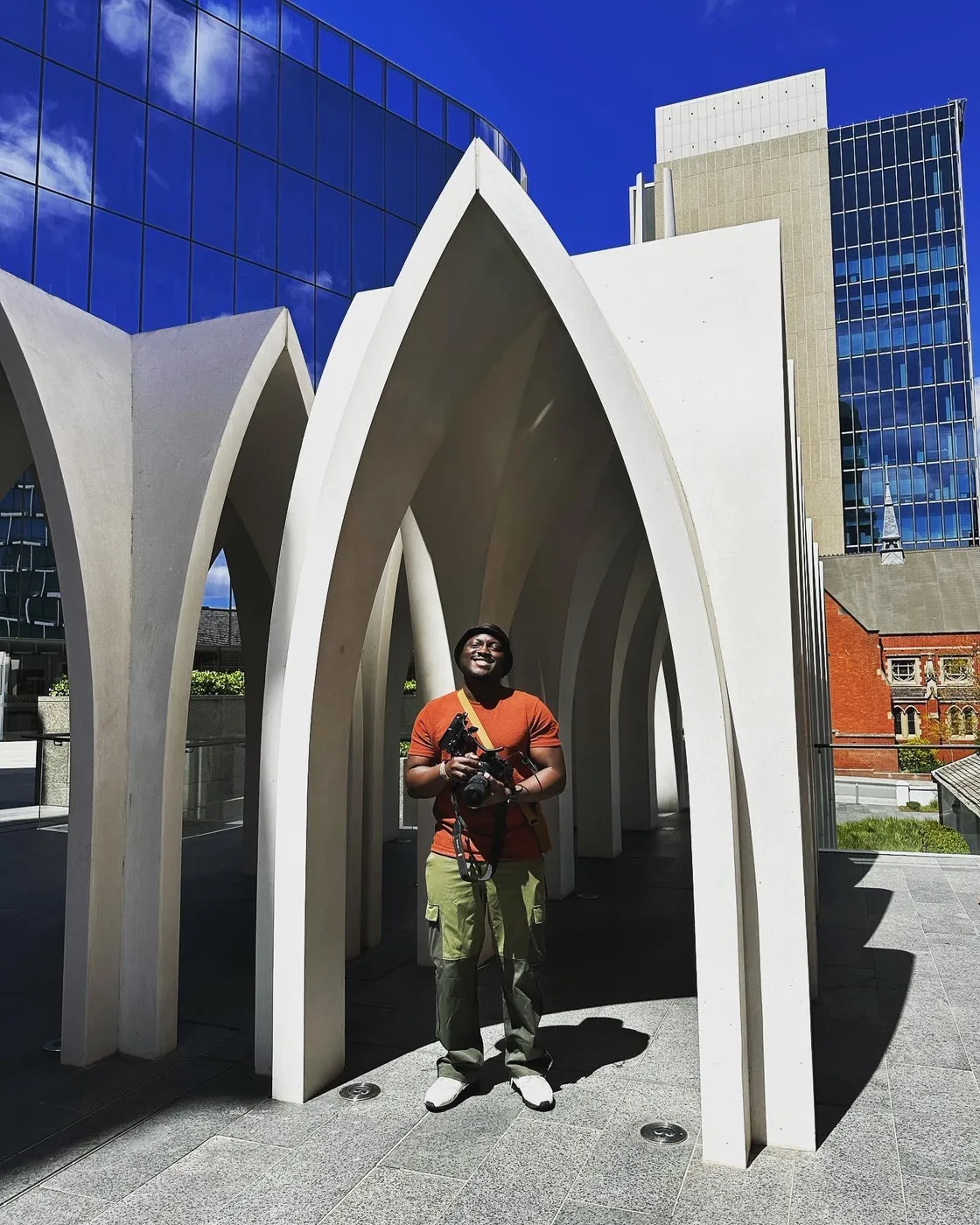 Imisi Bamiro holding a camera