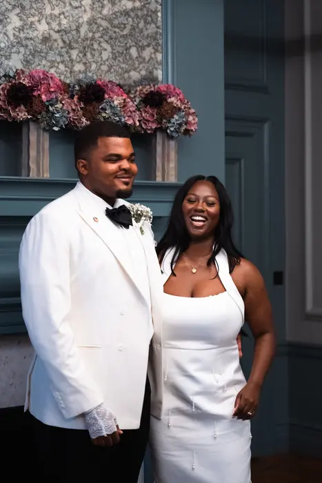 Bride and groom sharing a laugh after the wedding ceremony, photographed by Imisi Bamiro, Coventry photographer