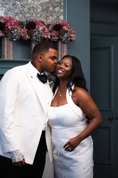 City wedding album: Bride and groom sharing a laugh after the wedding ceremony, photographed by Imisi Bamiro, Coventry photographer