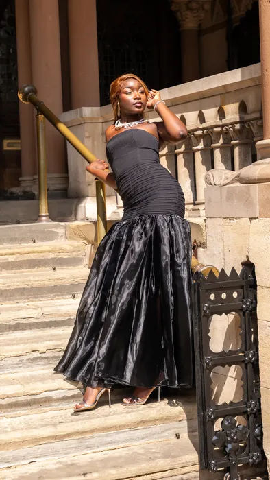 Fashion portraits in yellow and black gowns on stone steps, photographed by Imisi Bamiro, Coventry photographer