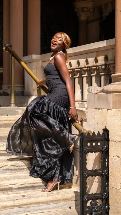 Fashion portraits in yellow and black gowns on stone steps, photographed by Imisi Bamiro, Coventry photographer