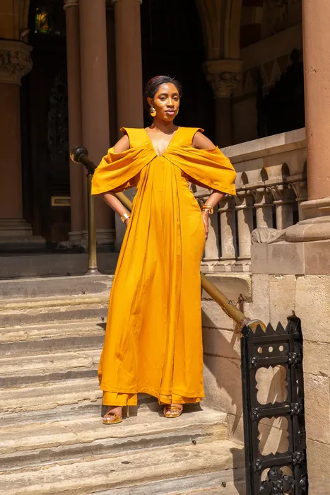 Fashion portraits in yellow and black gowns on stone steps, photographed by Imisi Bamiro, Coventry photographer
