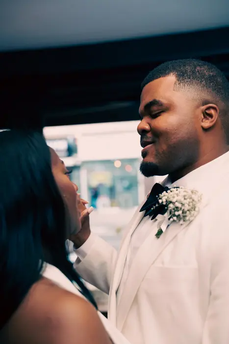 Groom smiling at the wedding reception, photographed by Imisi Bamiro, Coventry photographer