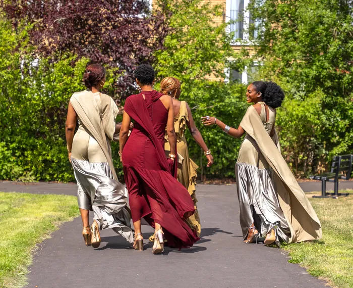 Group fashion shoot in satin gowns in a park, photographed by Imisi Bamiro, Coventry photographer