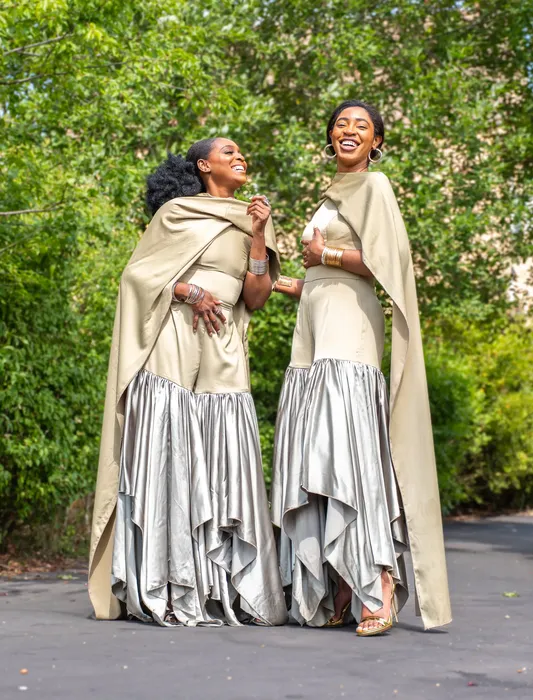 Group fashion shoot in satin gowns in a park, photographed by Imisi Bamiro, Coventry photographer