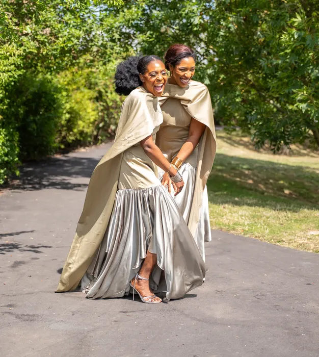 Group fashion shoot in satin gowns in a park, photographed by Imisi Bamiro, Coventry photographer