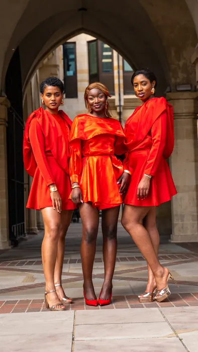 Three women in matching red dresses, fashion editorial, photographed by Imisi Bamiro, Coventry photographer