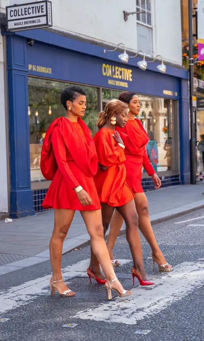 Three women in matching red dresses, fashion editorial, photographed by Imisi Bamiro, Coventry photographer