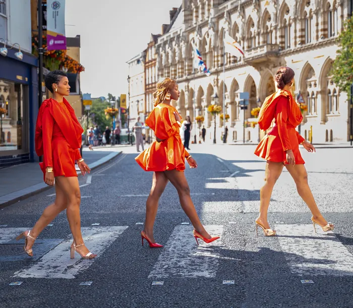 Three women in matching red dresses, fashion editorial, photographed by Imisi Bamiro, Coventry photographer
