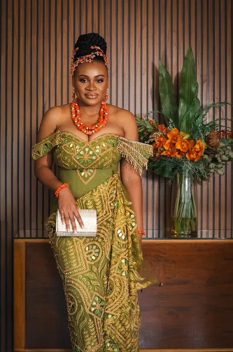Traditional wedding portrait, couple in green and coral beads, photographed by Imisi Bamiro, Coventry photographer