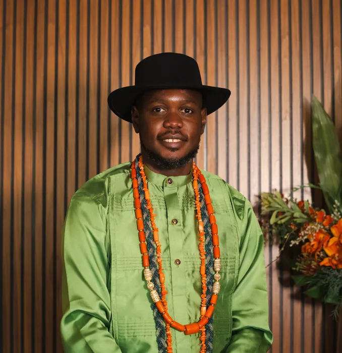 Traditional wedding portrait, couple in green and coral beads, photographed by Imisi Bamiro, Coventry photographer