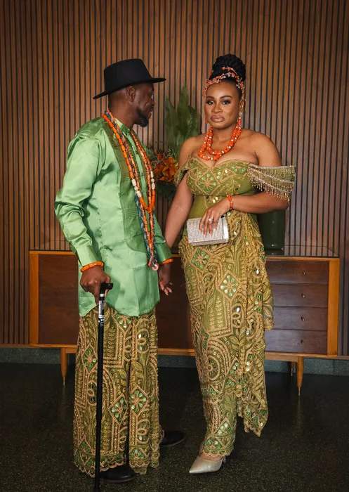 Traditional wedding portrait, couple in green and coral beads, photographed by Imisi Bamiro, Coventry photographer
