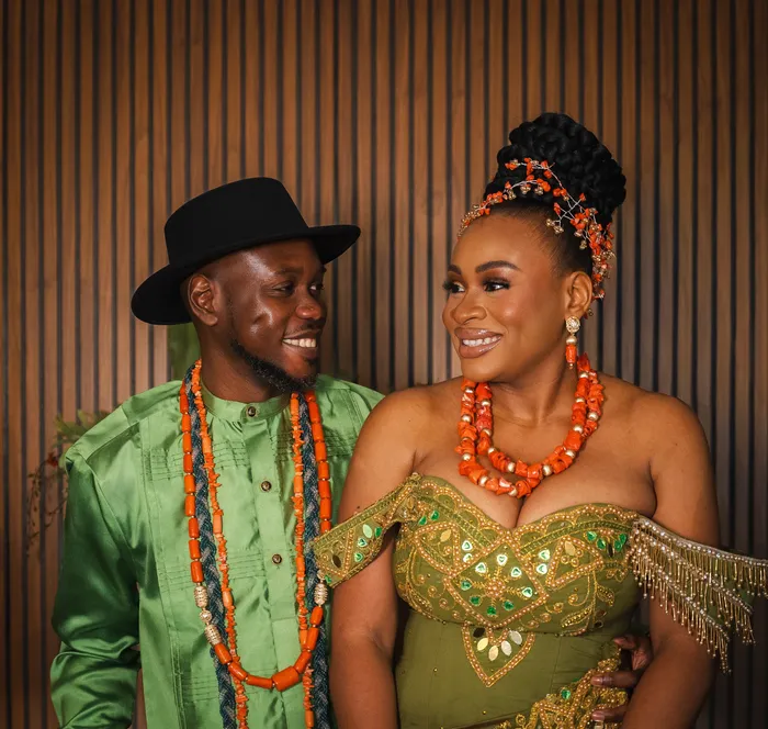Traditional wedding portrait, couple in green and coral beads, photographed by Imisi Bamiro, Coventry photographer
