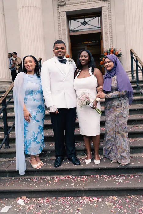 Wedding party and family portraits on the steps, photographed by Imisi Bamiro, Coventry photographer