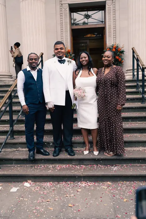 Wedding party and family portraits on the steps, photographed by Imisi Bamiro, Coventry photographer