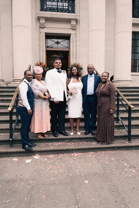 Wedding party and family portraits on the steps, photographed by Imisi Bamiro, Coventry photographer