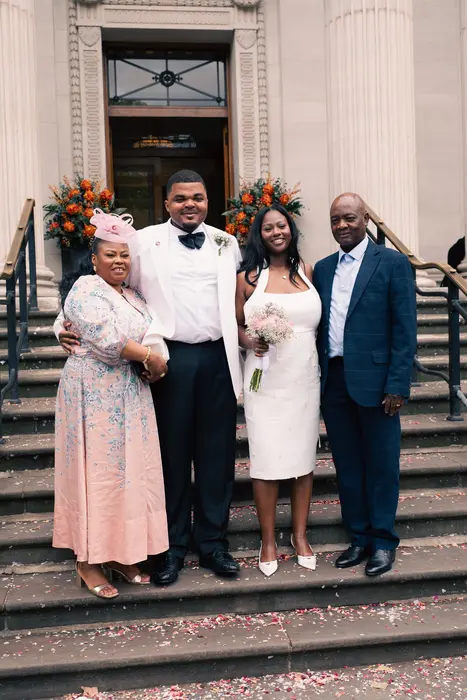 Wedding party and family portraits on the steps, photographed by Imisi Bamiro, Coventry photographer