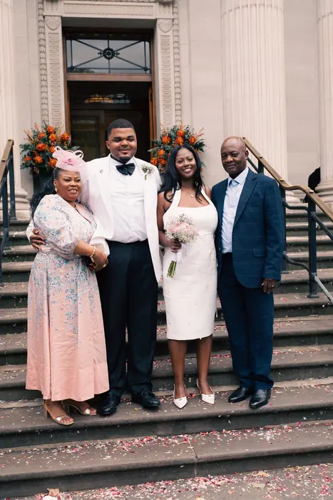 Wedding party and family portraits on the steps, photographed by Imisi Bamiro, Coventry photographer