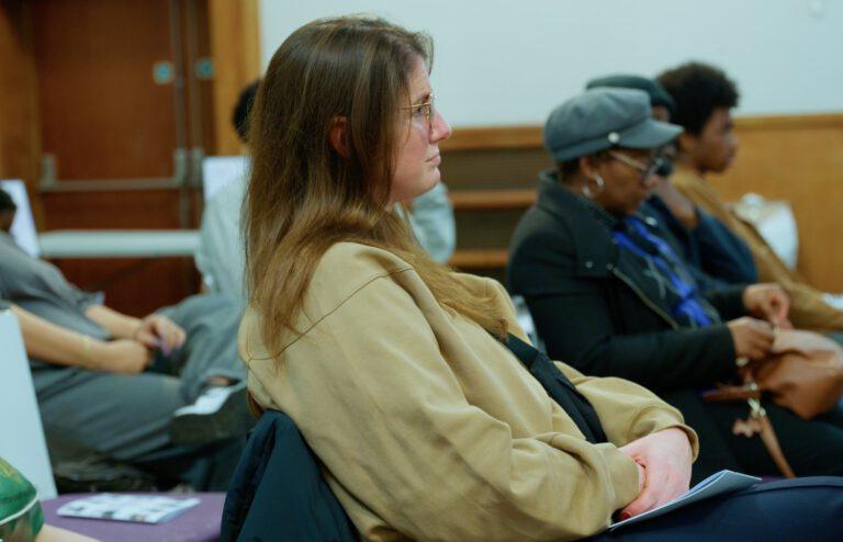 white woman sitting down